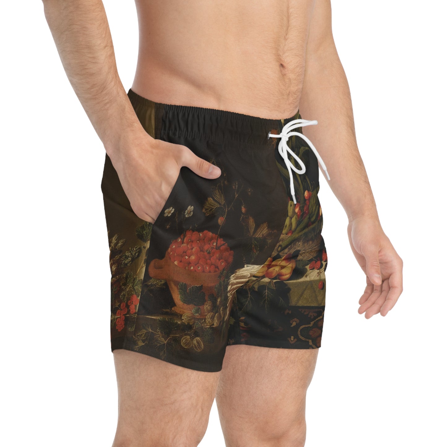 Black swim shorts with a colorful abstract design worn by a person on a white background